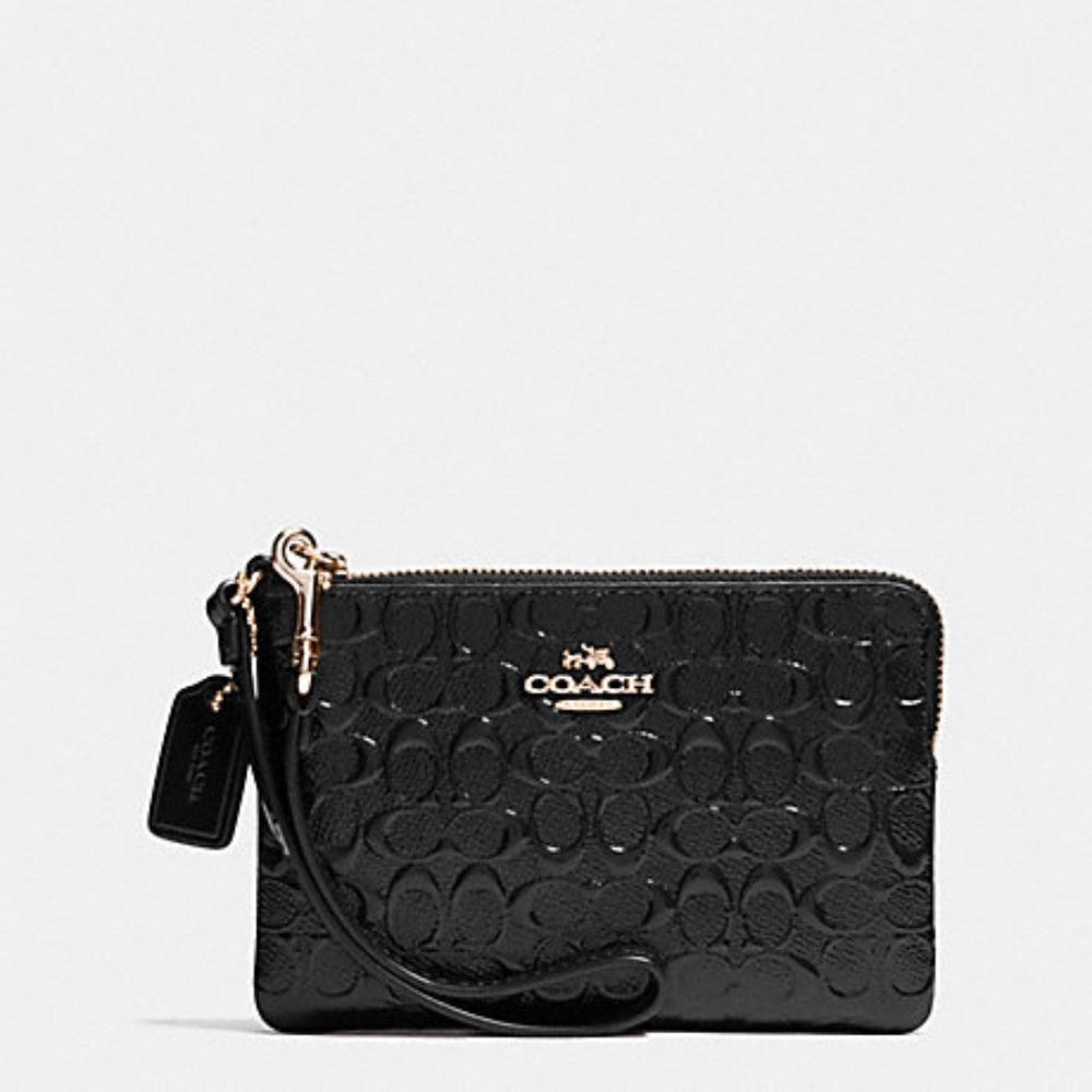 Super cute black COACH wristlet.